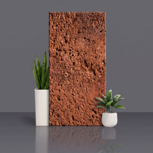 Red laterite stone panel with a porous, pitted natural surface
