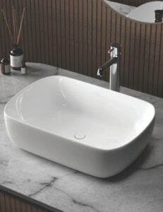 Rectangular white ceramic countertop vessel basin with rounded corners